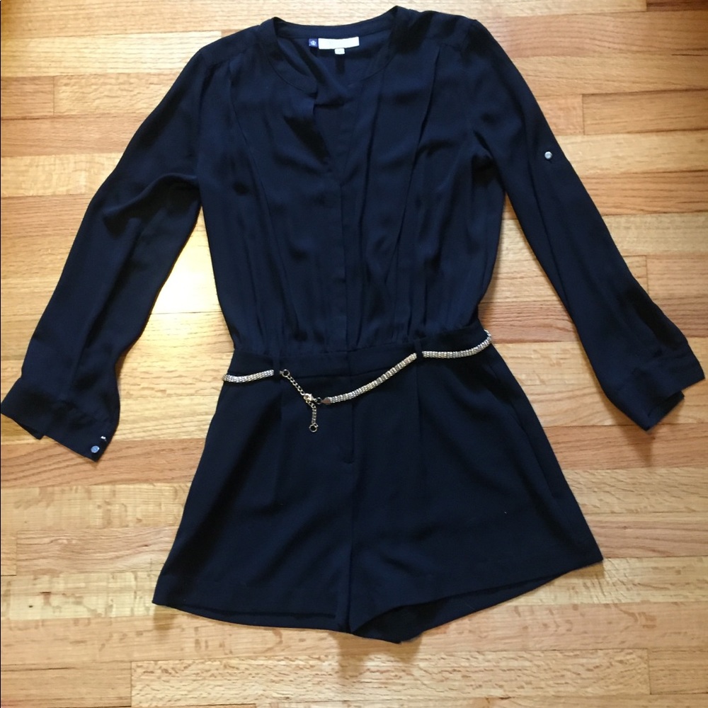 Long sleeved, belted, black romper. Size 6